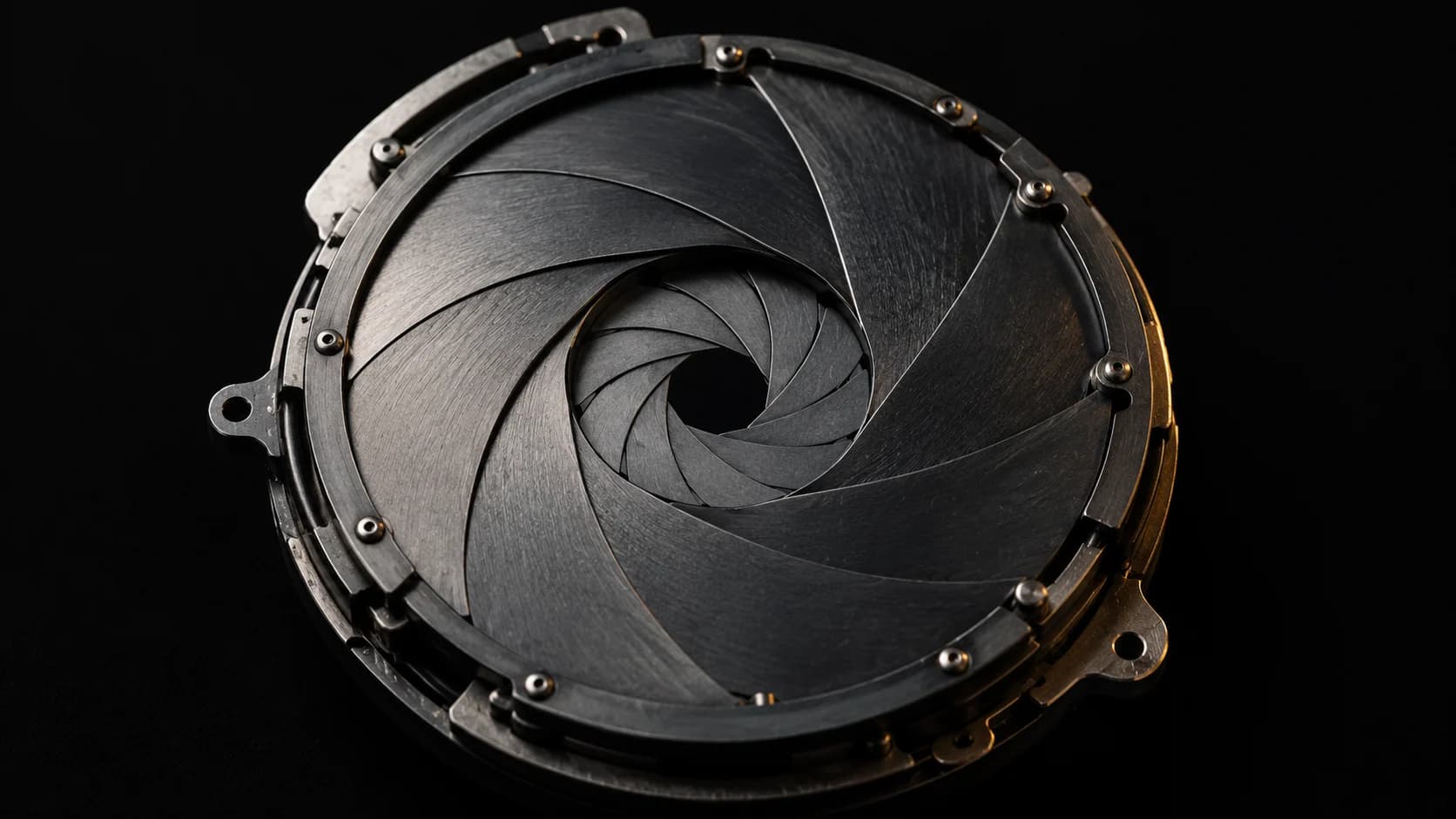 Double-exposed mechanical shutter blades in one solid object.