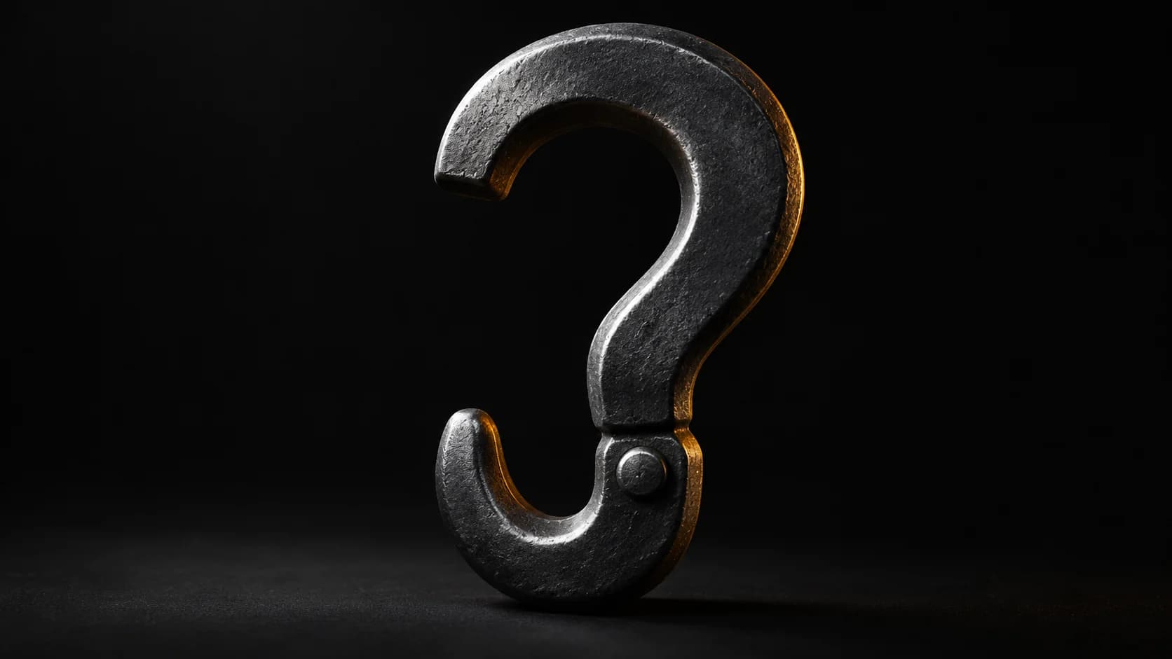 Dark metal question-shaped hook without lettering.
